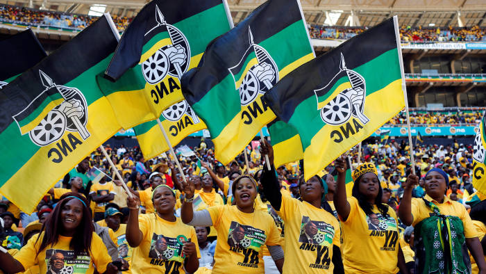 FILE PHOTO: Supporters of South Africa's President Jacob Zuma's ruling African National Congress (ANC) cheer during their party's final election rally in Soweto, South Africa, May 4, 2014. REUTERS/Mike Hutchings/File Photo