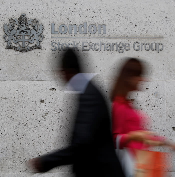 People walk past the entrance of the London Stock Exchange in London, Britain. Aug 23, 2018. REUTERS/Peter Nicholls