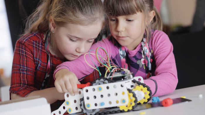 WARSAW, POLAND, OCTOBER 21, 2017: Ewa and Kinga, both 7, constructing and playing with robotic toys during SuperDojo workshop, with hardware and software provided by Skriware, a Polish-swedish startup. (Photo by Piotr Malecki)