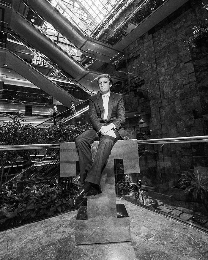 Donald J. Trump on a bronze T in the Trump Tower atrium on 5th Avenue, in Manhattan, New York, NY, July 19, 1983. (Don Hogan Charles/The New York Times) / Redux / eyevine Please agree fees before use. SPECIAL RATES MAY APPLY. For further information please contact eyevine tel: +44 (0) 20 8709 8709 e-mail: info@eyevine.com www.eyevine.com