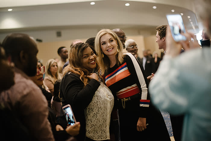 Victoria Osteen greets congregants in the church lobby – up to 50,000 people flock here every week to attend its services