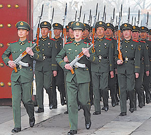 Chinese paramilitary soldiers train outside their barracks