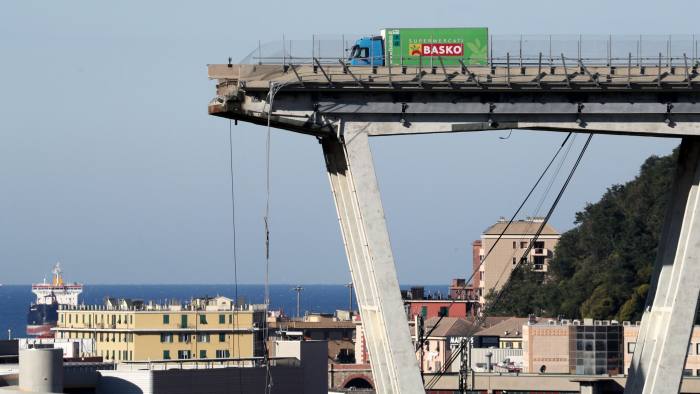 The collapsed Morandi Bridge is seen in the Italian port city of Genoa, Italy August 15, 2018. REUTERS/Stefano Rellandini