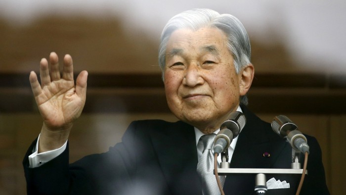Japan's Emperor Akihito waves to well-wishers who gathered at the Imperial Palace to mark his 82nd birthday in Tokyo, Japan, December 23, 2015. REUTERS/Thomas Peter/File photo TPX IMAGES OF THE DAY