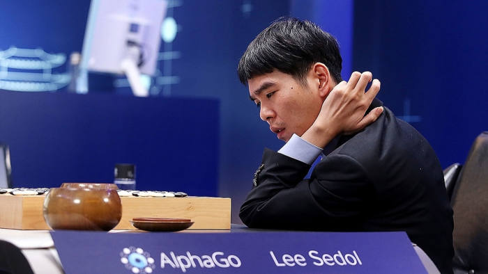 In this handout image provided by Google, South Korean professional Go player Lee Se-Dol reviews the match after the fourth match against Google's artificial intelligence program, AlphaGo, during the Google DeepMind Challenge Match on March 13, 2016 in Seoul, South Korea