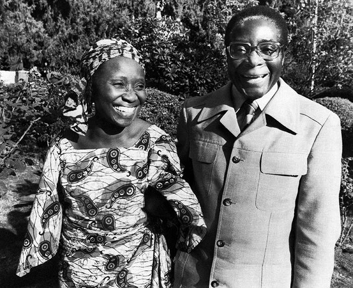 Smiling happily, Robert Mugabe, Rhodesian President Designate and his Ghanaian wife, Sally, hold hands in the rose garden of their Salisbury bungalow, Zimbabwe, on March 6, 1980, during a brief interlude between continuous business visits as Mugabe worked at forming a Government following his party’s landslide electoral victory. (AP Photo/Louise Gubb)