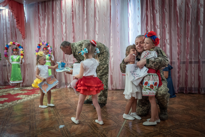 Europe's forgotten war. By David Bond. The conflict in Eastern Ukraine between Russian backed separatists and Ukrainian forces has been raging for 4 years and claimed 10,000 lives yet largely forgotten in the West. Picture shows Ukrainian soldiers visiting a kindergarten near the town of Boudhna.
