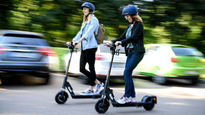 epa07627037 Women ride an CIRC e-scooter (former FLASH) in Herne, Germany, 05 June 2019. Even before electric pedal-scooters are allowed nationwide on 15 June, a first provider will start a rental service in the Ruhr area. In the city of Herne, several dozens of electric scooters are to be put on the road from 05 June with the permission of local authorities. EPA-EFE/SASCHA STEINBACH