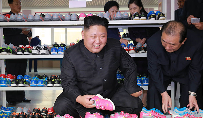 This undated picture released from North Korea's official Korean Central News Agency (KCNA) on October 19, 2017 shows North Korean leader Kim Jong-Un (front L) visiting the Ryuwon Footwear Factory in Pyongyang. / AFP PHOTO / KCNA VIA KNS / STR / - South Korea OUT / REPUBLIC OF KOREA OUT ---EDITORS NOTE--- RESTRICTED TO EDITORIAL USE - MANDATORY CREDIT &quot;AFP PHOTO/KCNA VIA KNS&quot; - NO MARKETING NO ADVERTISING CAMPAIGNS - DISTRIBUTED AS A SERVICE TO CLIENTS THIS PICTURE WAS MADE AVAILABLE BY A THIRD PARTY. AFP CAN NOT INDEPENDENTLY VERIFY THE AUTHENTICITY, LOCATION, DATE AND CONTENT OF THIS IMAGE. THIS PHOTO IS DISTRIBUTED EXACTLY AS RECEIVED BY AFP. / STR/AFP/Getty Images
