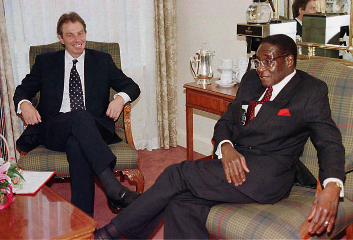 File photo dated 24/10/97 of Tony Blair (left) and Robert Mugabe, whose legacy as one of the most ruthless tyrants of modern times will remain long after his days as notorious statesman of Zimbabwe are over. PRESS ASSOCIATION Photo. Issue date: Wednesday November 15, 2017. What could turn out to be the 93-year-old leader's final night in charge of the troubled south African nation concluded in typically chaotic fashion with the army saying it had Mugabe and his ambitious wife Grace in custody following a takeover of the state broadcaster. See PA story POLITICS Zimbabwe Profile. Photo credit should read: PA Wire