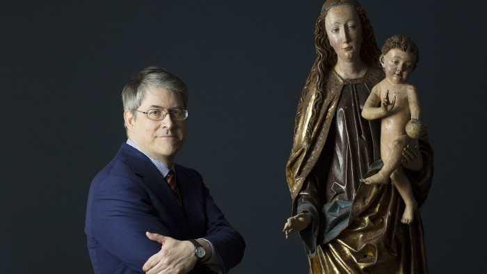 Andrew Butterfield, who has devoted years to researching sculptures, with one of his discoveries in New York