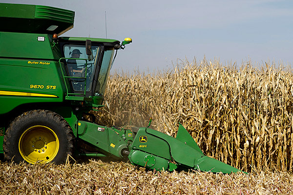 Corn is harvested with a John Deere 9670 STS combine harvester outside Malden, Illinois, U.S., on Thursday, Oct. 10, 2013. 