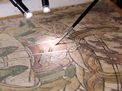 A Chinese wall painting fragment during conservation treatment