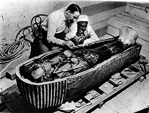 Howard Carter examining Tutankhamun’s casket