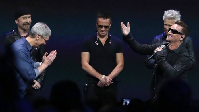From left, The Edge, Apple CEO Tim Cook, Larry Mullen Jr, Adam Clayton and Bono at Apple's launch event on September 9 in Cupertino, California