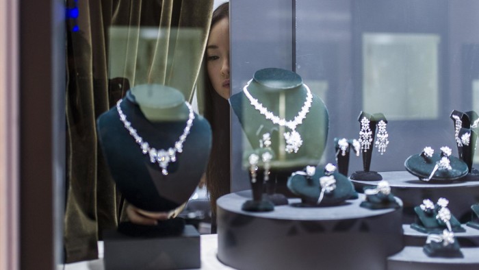 A vendor checks a display prior to the opening of the Hong Kong Jewellery and Gem fair at the convention and exhibition Centre on September 17, 2014. The United States is likely to remain the world's largest market for diamonds for the next 15 years despite a growing appetite for the gems from China and India, leading producer De Beers said on September 17. AFP PHOTO / XAUME OLLEROSXAUME OLLEROS/AFP/Getty Images