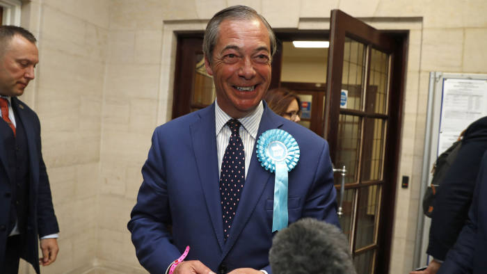 FILE - In this Sunday, May 26, 2019 file photo, Brexit Party leader Nigel Farage speaks to the media in Southampton, England. A 32-year-old man has been sentenced to community service for dousing pro-Brexit politician Nigel Farage with a milkshake. Paul Crowther pleaded guilty Tuesday, June 18 to common assault and criminal damage. District Judge Bernard Begley called the stunt an "act of crass stupidity motivated by your political views" and ordered Crowther to do 150 hours of volunteer work and pay Farage 350 pounds ($438) in damages. (AP Photo/Alastair Grant, file)