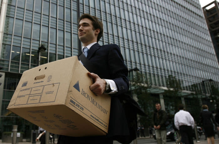 A worker carries a box out of the U.S. investment bank Lehman Brothers in London...A worker carries a box out of the U.S. investment bank Lehman Brothers offices in the Canary Wharf district of London September 15, 2008. The ruptured U.S. financial system faces an unprecedented shake-up with Lehman Brothers filing for bankruptcy, Bank of America buying Merrill Lynch and the Federal Reserve saying for the first time it will accept stocks in exchange for cash loans. REUTERS/Andrew Winning (BRITAIN)
