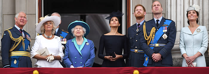 (left to right) Prince of Wales, Duke of York (obscured), the Duchess of Cornwall, Queen Elizabeth II, Duchess of Sussex, Duke of Sussex, Duke of Cambridge and Duchess of Cambridge on the balcony at Buckingham, Palace where they watched a Royal Air Force flypast over central London to mark the centenary of the Royal Air Force.. PRESS ASSOCIATION Photo. Picture date: Tuesday July 10, 2018. See PA story DEFENCE RAF100. Photo credit should read: Victoria Jones/PA Wire