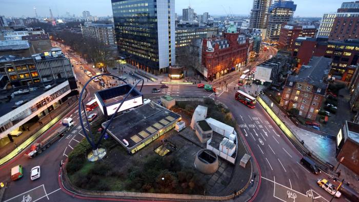 Traffic passes around the Old Street roundabout, in the area known as London's Tech City, in London, U.K., on Tuesday, Dec. 17, 2013. The U.K government last year pledged 50 million pounds for a new London startup incubator, and hired ex-Facebook Inc. executive Joanna Shields to promote Tech City, with Google Inc., Amazon.com Inc., and Cisco Systems Inc. all having taken space in the area or planning to do so. Photographer: Chris Ratcliffe/Bloomberg
