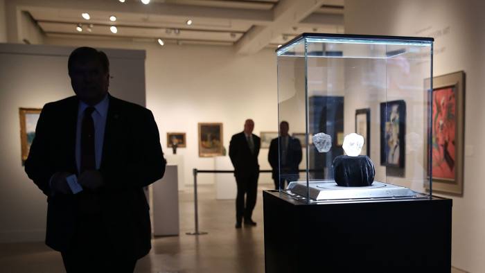 Sotheby's To Auction Off Largest Diamond Discovered In 100 Years...NEW YORK, NY - MAY 04: The 1109-carat rough Lesedi La Rona diamond, the biggest rough diamond discovered in more than a century, sits in a display case at Sotheby's on May 4, 2016 in New York City. The stone was found by Lucara Diamond Corp. last year at its Karowe mine in Botswana. The diamond, which is nearly the size of a tennis ball at 66.4 x 55 x 42mm and is believed to be about 2.5 billion to 3 billion years old, was named "Our Light" in the local Tswana language. Lesedi La Rona will be offered at auction in London on June 29 and be on display at Sotheby's New York. The diamond could sell for $70 million or more. (Photo by Spencer Platt/Getty Images)