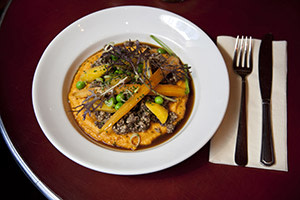 A dish of MacSween's Haggis and carrot purée
