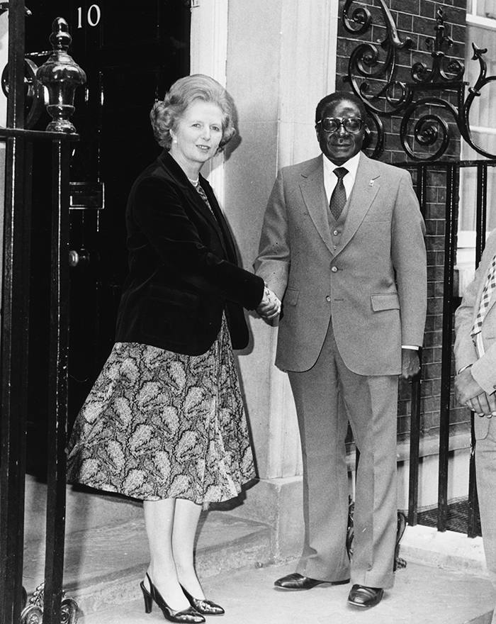 British Prime Minister Margaret Thatcher shaking hands with Zimbabwe Prime Minister Robert Mugabe outside 10 Downing Street, London, May 9th 1980. (Photo by Monti Spry/Central Press/Getty Images)