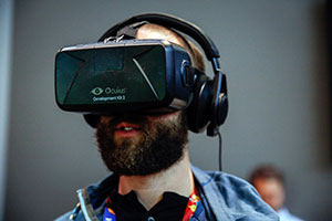 A man wearing an Oculus virtual reality headset
