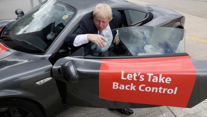 LEEDS, ENGLAND - MAY 23: Boris Johnson MP emerges from a sports car after it performed 'donuts' during a visit to Ginetta Sports cars as part of the Brexit Battle Bus tour in Yorkshire on May 23, 2016 in Leeds, England. Boris Johnson and the Vote Leave campaign are touring the UK in their Brexit Battle Bus. The campaign is hoping to persuade voters to back leaving the European Union in the Referendum on the 23rd June 2016. (Photo by Christopher Furlong/Getty Images)