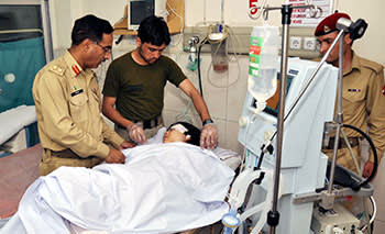 Pakistani army doctors treating Malala the day after she was shot in the head by the Taliban on October 9 2012
