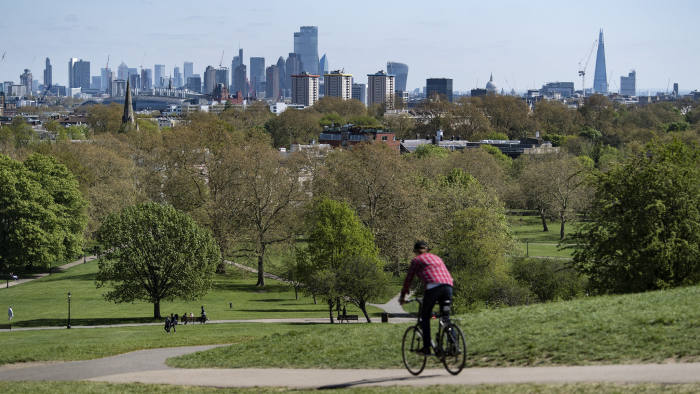 © Licensed to London News Pictures. 14/04/2020. London, UK. A clear view of the London city skyline, all the way through to Canary Wharf, from Primrose Hill in North London, during a pandemic outbreak of the Coronavirus COVID-19 disease. Air quality and pollution levels in the capital have been significantly lower since the introduction of a lockdown to fight the spread of COVID-19 . Photo credit: Ben Cawthra/LNP