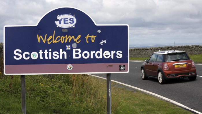 A car enters the Scottish Borders at the border between Scotland and England at Carter Bar on the A68 