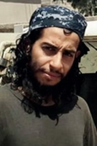 This undated image made available in the Islamic State's English-language magazine Dabiq, shows Belgian national Abdelhamid Abaaoud. Abaaoud, the child of Moroccan immigrants who grew up in the Belgian capital’s Molenbeek-Saint-Jean neighborhood, was identified by French authorities on Monday Nov. 16, 2015, as the presumed mastermind of the terror attacks last Friday in Paris that killed over a hundred people and injured hundreds more. (Militant Photo via AP)