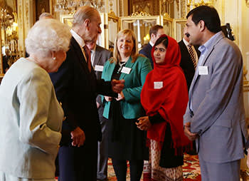 Malala and her father, Ziauddin, at a Buckingham Palace reception with the Queen on October 18 2013