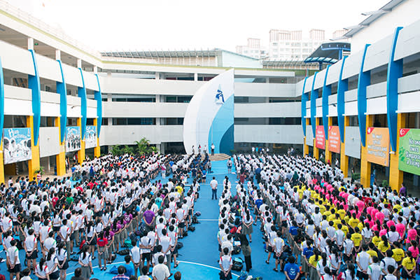 Morning assembly at Admiralty. A sense of being dwarfed by vast neighbours runs deep in Singapore’s psyche, and is reflected in the giant banners in the courtyard