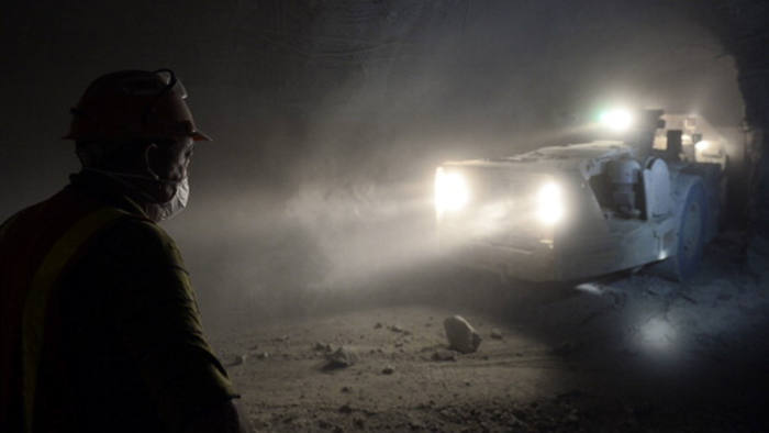 A miner works at the Cullinan Diamond Mine, 100 kms north-east of Johannesburg, on October 10, 2013 in Cullinan