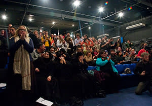 The audience applauds after the performance