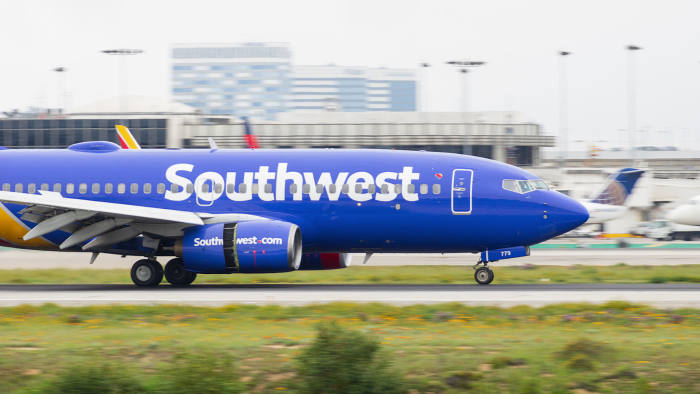 LOS ANGELES INTERNATIONAL AIRPORT, CA/USA - MARCH 7, 2018: Southwest Airlines jet shown landing at LAX.; Shutterstock ID 1071033323; Department: -; Job/Project: -; Employee Name: -