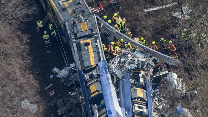 Aerial view shows firefighters and emergency doctors working at the site of a train accident near Bad Aibling, southern Germany, on February 9, 2016.