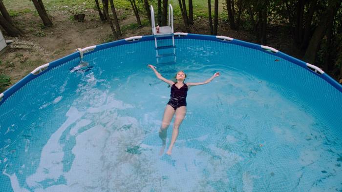It Follows Monster - When Jay first appeared, she was in the pool alone enjoying what should have been very private. But in small detail, there were two neighborhood boys who hid in a nearby bush and surreptitiously watched their 19-year-old sister in a bikini.