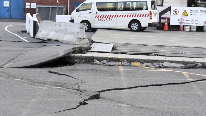 Fissures run along a road by the Centre Port in Wellington, Monday, November 14, 2016, after a major earthquake struck New Zealand's south Island early Monday. A powerful earthquake struck in a mostly rural area close to the city of Christchurch but appeared to be more strongly felt in the capital, Wellington, more than 200 Km (120 miles) away. (Ross Setford/SNPA via AP)
