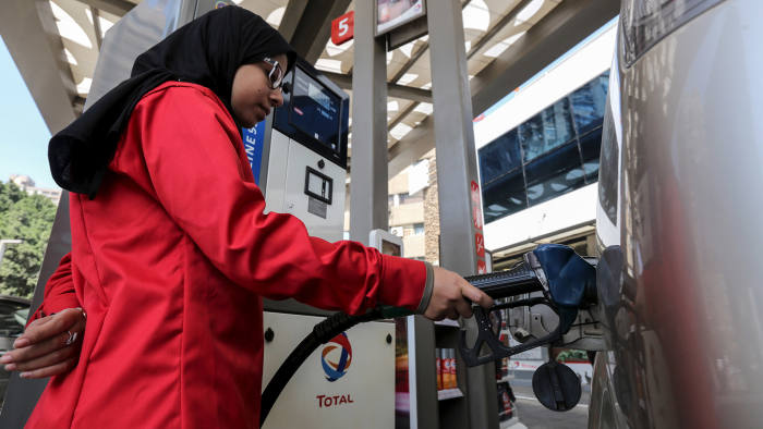 A female employee fills the tank of a car at a petrol station in Cairo, Egypt, February 24, 2016. A petrol station in the Egyptian capital Cairo hires women to work as attendants - until now, petrol stations were staffed almost exclusively by men. Picture taken February 24, 2016. REUTERS/Mohamed Abd El Ghany - GF10000326794