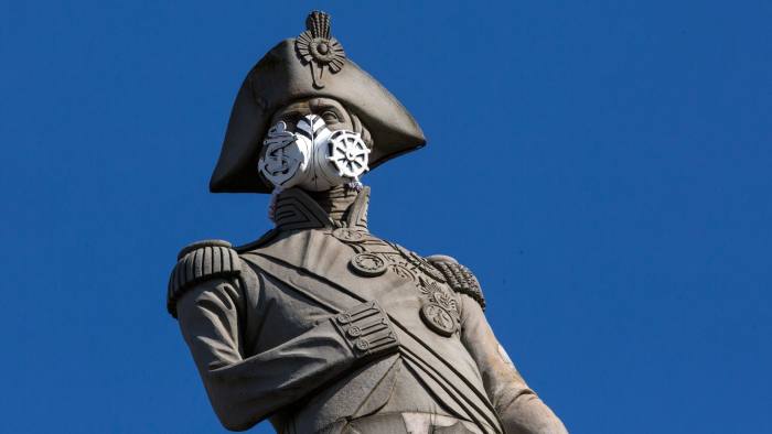 LONDON, ENGLAND - APRIL 18: A face mask is placed on the statue of Nelson's Column by Greenpeace protesters on April 18, 2016 in London, England. The demonstration was to highlight air pollution in Britain and targeted other statues in the city including Queen Victoria opposite Buckingham Palacea and Eros at Piccadilly Circus. (Photo by Dan Kitwood/Getty Images)