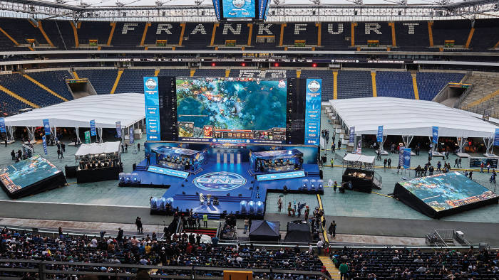 The stage at Frankfurt’s Commerzbank-Arena, with the two competing e-sports teams flanked by booths for the commentators and analysts