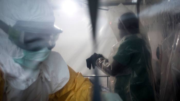 Two medical workers are seen in a Biosecure Emergency care Unite (CUBE) on August 15, 2018 in Beni. - The new ETC will hold ten Biosecure Emergency care Unite (CUBEs), which will be used for the first time to treat Ebola patients and are currently being constructed by (ALIMA) The Alliance for International Medical Action in response to the ebola outbreak. (Photo by John WESSELS / AFP)JOHN WESSELS/AFP/Getty Images
