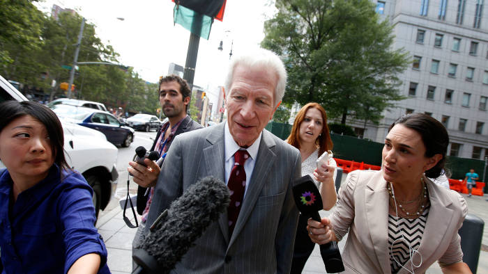 Mediator Daniel Pollack, center, leaves federal court after a hearing regarding Argentina's request to extend deadlines to repay a $1.65 billion debt to US hedge funds, Friday, June 27, 2014, in New York.