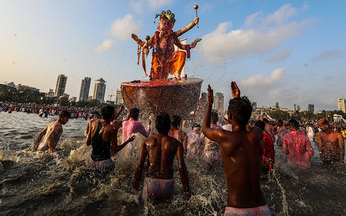 Mandatory Credit: Photo by DIVYAKANT SOLANKI/EPA-EFE/REX/Shutterstock (9889846x) Indian devotees carry an idol of the elephant-headed Hindu god Lord Ganesha for immersion into the Arabian Sea, as part of a ritual of the Ganpati festival in Mumbai, India, 23 September 2018. The Ganesh festival comes to an end on the day of Anant Chaturdashi. During the Ganpati festival, that is celebrated as the birthday of Lord Ganesh, idols of the Hindu deity are worshipped at hundreds of pandals or makeshift tents before they are immersed into water bodies. Ganesh Festival in Mumbai, India - 23 Sep 2018