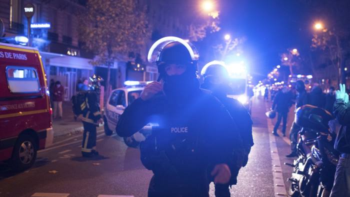 Elite police officers arrive outside the Bataclan theater  in Paris, France, Wednesday, Nov. 13, 2015. Several dozen people were killed in a series of unprecedented attacks around Paris on Friday, French President Francois Hollande said, announcing that he was closing the country's borders and declaring a state of emergency. (AP Photo/Kamil Zihnioglu)
