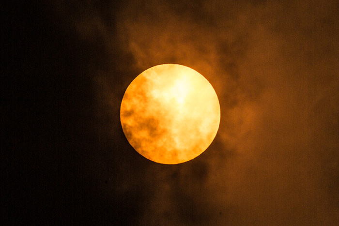 UNSPECIFIED, UNITED KINGDOM - OCTOBER 16: The sun goes a golden yellow colour due to dust from the Sahara being blown in with Storm Ophelia on October 16, 2017 in Fulham, London, England. (Photo by Rob Ball/Getty Images)