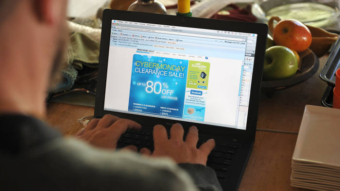 A man looks at a Cyber Monday advertisement on his laptop computer in Los Angeles on November 30, 2009. AFP PHOTO/Robyn Beck (Photo credit should read ROBYN BECK/AFP via Getty Images)